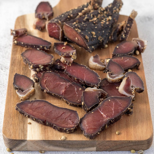 biltong, beef snack, high-protein snack, keto snack, paleo snack Secondary Keywords: air-dried meat, premium steak cuts, low-carb snack, gluten-free snack, sugar-free snack Related Terms: healthy snack, guilt-free snack, complete protein, essential amino acids, muscle recovery, natural ingredients, artisanal biltong, handcrafted biltong, savory snack, tender beef, preservative-free, jerky alternative, fitness snack, energy boost, outdoor snack, hiking snack, workout snack